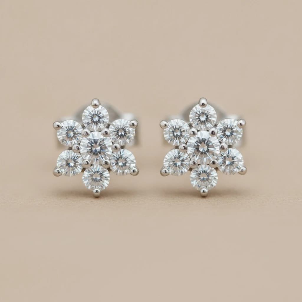 Pair of diamond cluster stud earrings in 14k white gold with flower-like diamond clusters